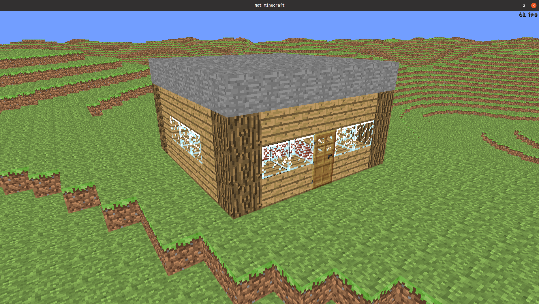 image description: screenshot of aforementioned minecraft-like game. I
have built a house out of various block, including a door.
